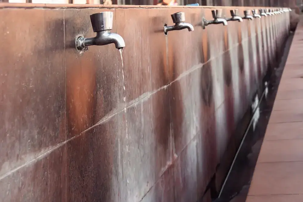 Water wastage from open taps - Nature Guard Foundation water conservation initiative